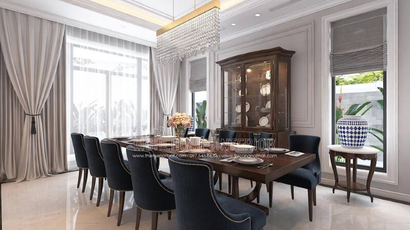 Trang trí nội thất phòng ăn gỗ óc chó tân cổ điển đẹp, sang trọng từ bàn gỗ nguyên khối, ghế bọc nệm cao cấp, kệ, tủ kệ trang trí. Thiết kế phòng ăn biệt thự