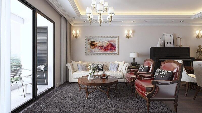 Phòng khách tân cổ điển với gam màu thật vintage của cặp ghế đơn sofa da màu đỏ khung gỗ với đường nét họa tiết hoàng gia mang