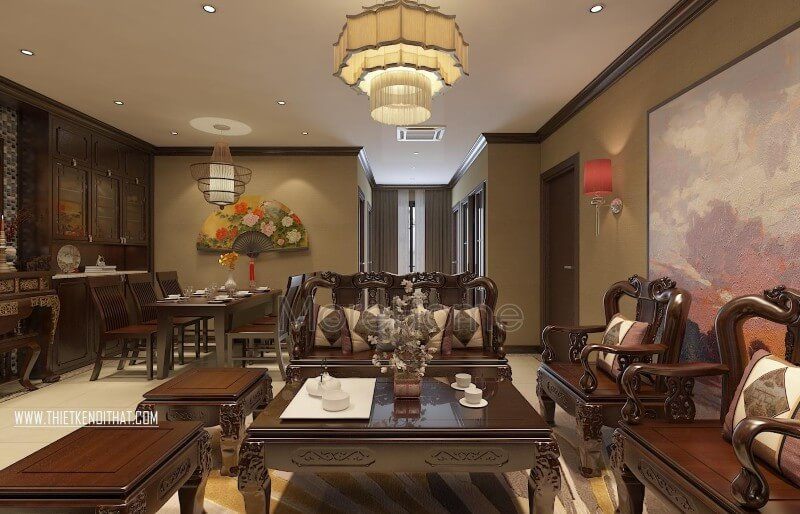 Phòng khách chung cư được trang trí theo phong cách Á Đông bằng các vật dụng như một chiếc đèn thả trần trung hoa và một bức họa phong cảnh nghệ thuật.