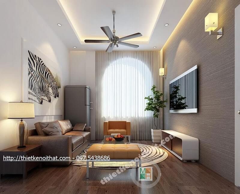 Sửa dụng tranh treo tường và giấy dán tường màu xám cho phòng khách giúp bức tường không còn bị thô cứng mà lại tạo được điểm nhấn cho căn phòng